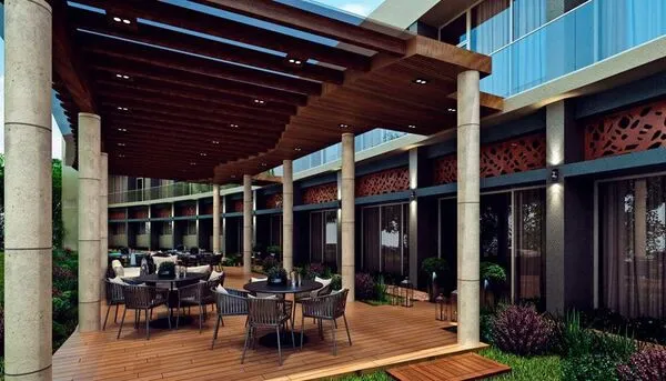 Terraza de lujo con mobiliario elegante y pérgola de madera diseñada por expertos arquitectos en Saltillo Coahuila.