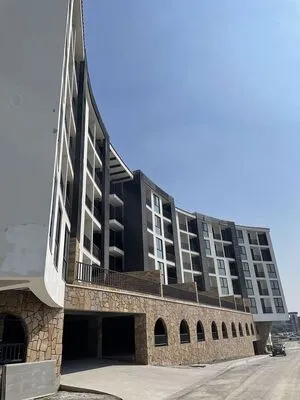 Arquitectura residencial multifamiliar con detalles en piedra natural de arquitectos en Tijuana Baja California líderes